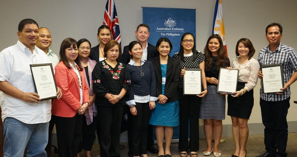 Australian alumni Guillermo Bonghanoy, Belinda Esguerra, Carla Magalona, Ann Marie Cunanan, Miday Umali, Lucita Dela Pena, and Gresal Tapulao at the Australian Embassy’s inaugural Alumni Grants Scheme awarding ceremony with Australian Embassy officials led by Senior Trade and Investment Commissioner Anthony Weymouth and Philippines Australia Human Resource Organisational Facility officers led by Director Milalin Javellana. 