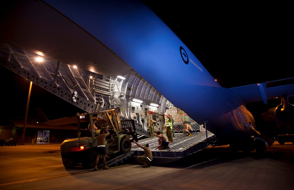Members of No. 1 Airfield Operational Support Squadron Darwin load a forklift last Tuesday into the cargo hold of a Philippines bound No.36 Squadron C-17A Globemaster that arrived on 13 November 2013. The forklift was used to unload supplies upon arrival in the Philippines. (Photo: CPL Glen McCarthy ©Commonwealth of Australia, Department of Defence)